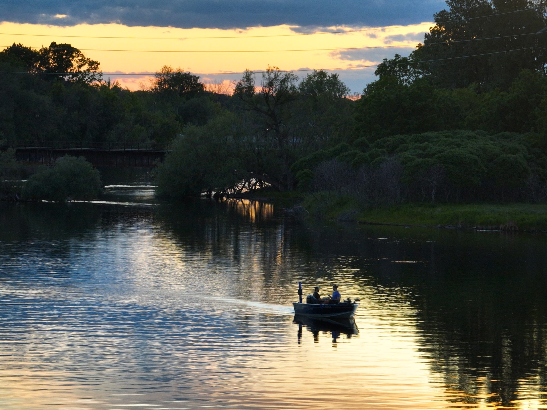 A fishing boat at sunset on the menominee river