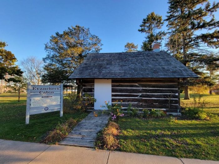 Picture of the exterior of an historic log cabin in Marinette