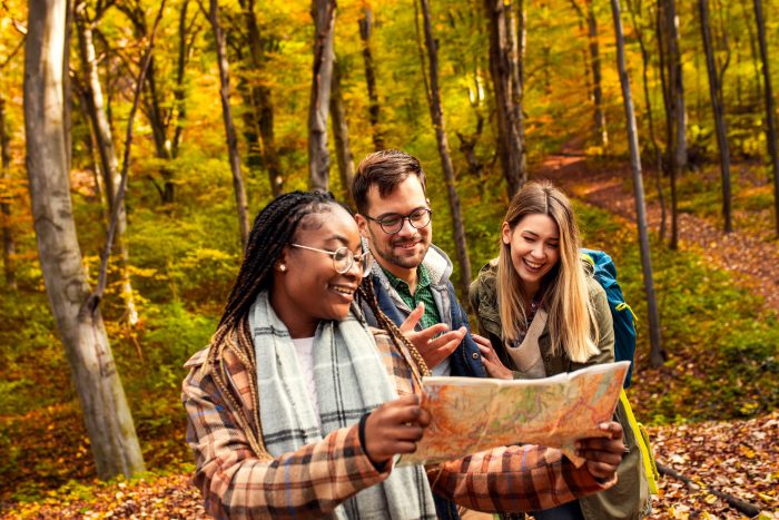 A group of people hiking in the woods in autumn in Wisconsin